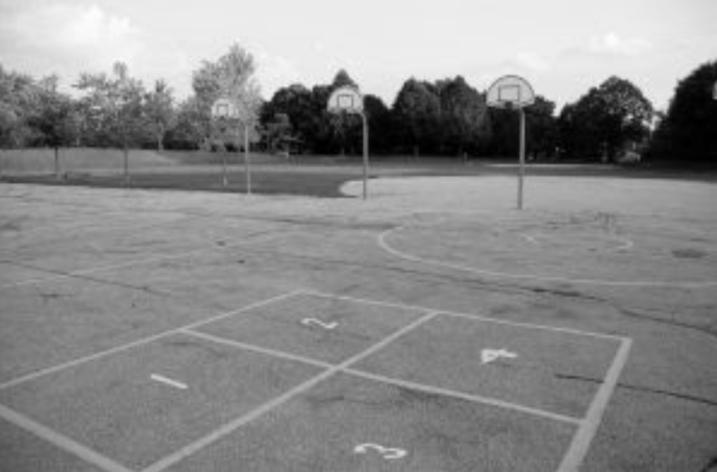 A typical four square layout at a school — surrounded by basketball courts and play structures. 