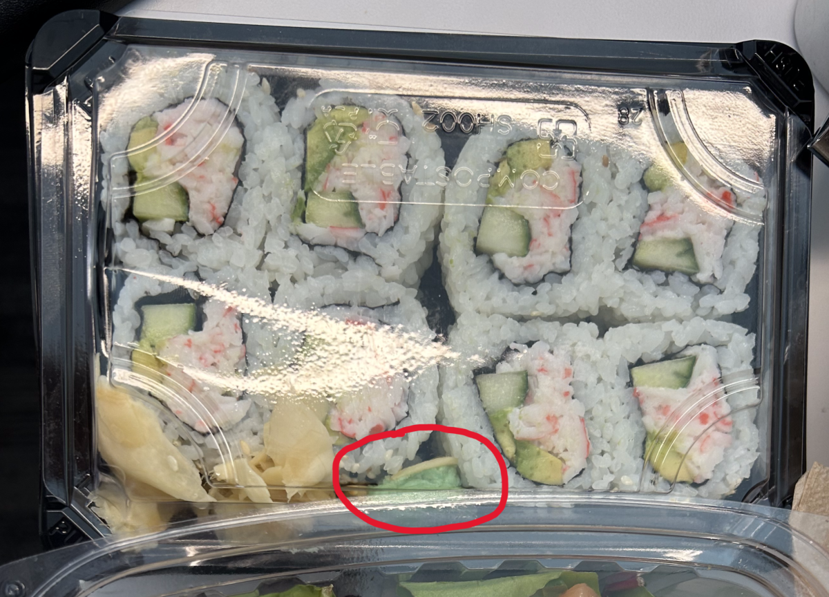 Two California rolls ruined by the wasabi adjacent to it.
