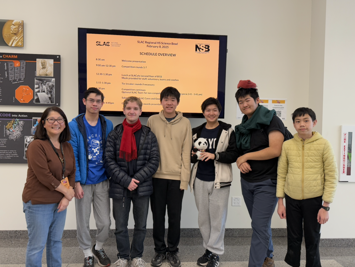 Team poses for a photo, from left to right: adviser science teacher Kathy Nakamatsu, team members Warren Chee, Max Rombakh, Skyler Mao, Ethan Pan, Alex Ge, and club member Edward Chee, who came to show support