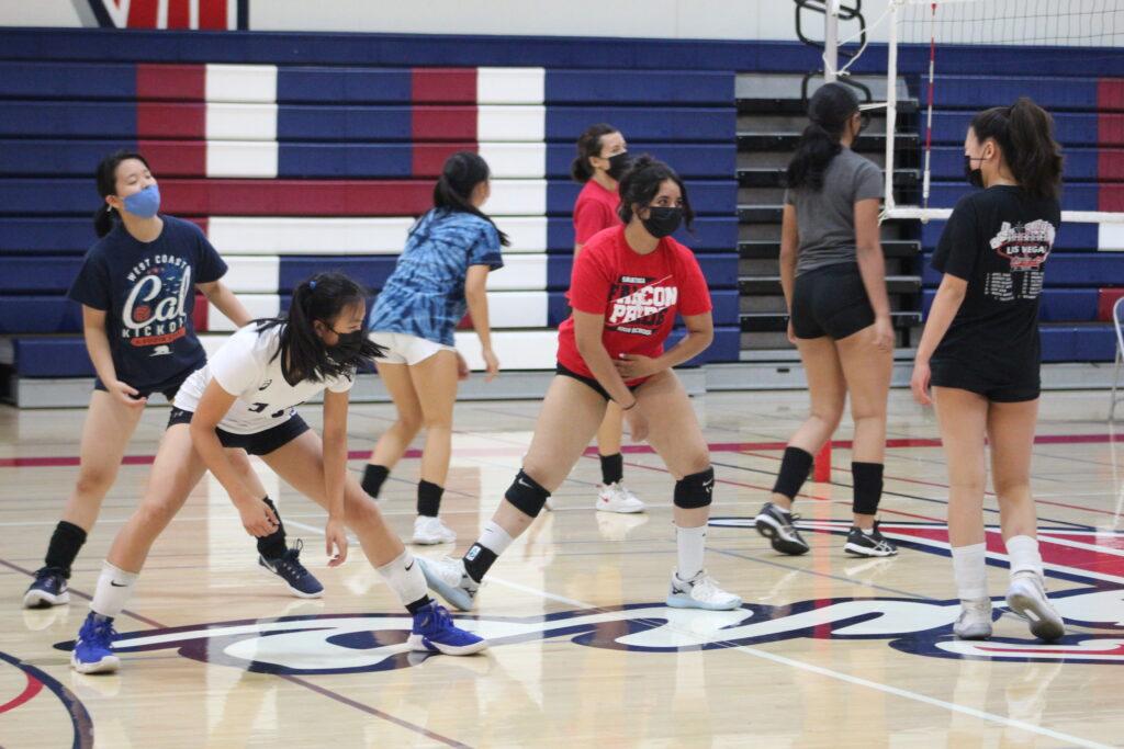 Girls’ volleyball team warms up for their scrimmage against Del Mar.
