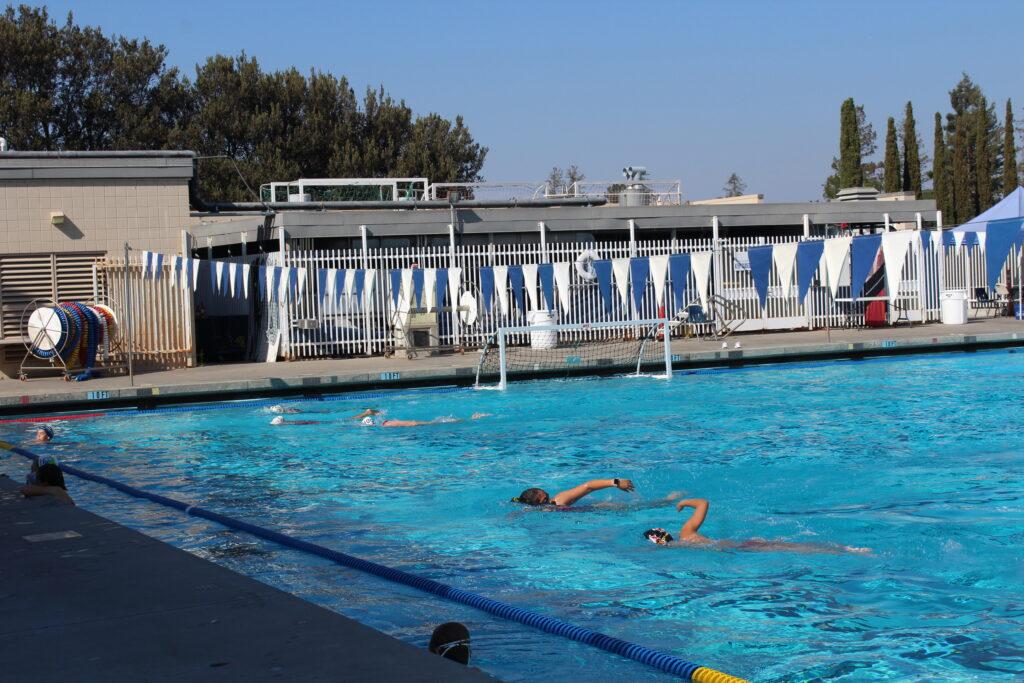 After school, athletes swim in the school pool for girls water polo practice.