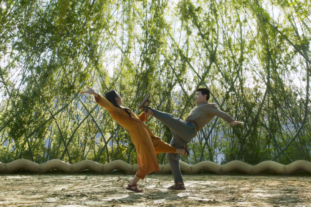 Nan Ying (Michelle Yeoh) teaches Shang-Chi Xu (Simu Liu) to fight in a magical land.