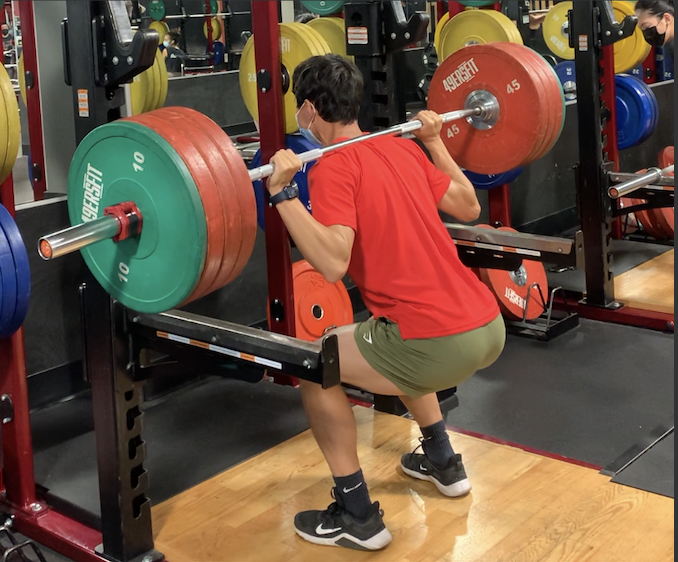 Senior Benjamin Li aiming for a personal record in the back squat exercise at 49ers Fit.
