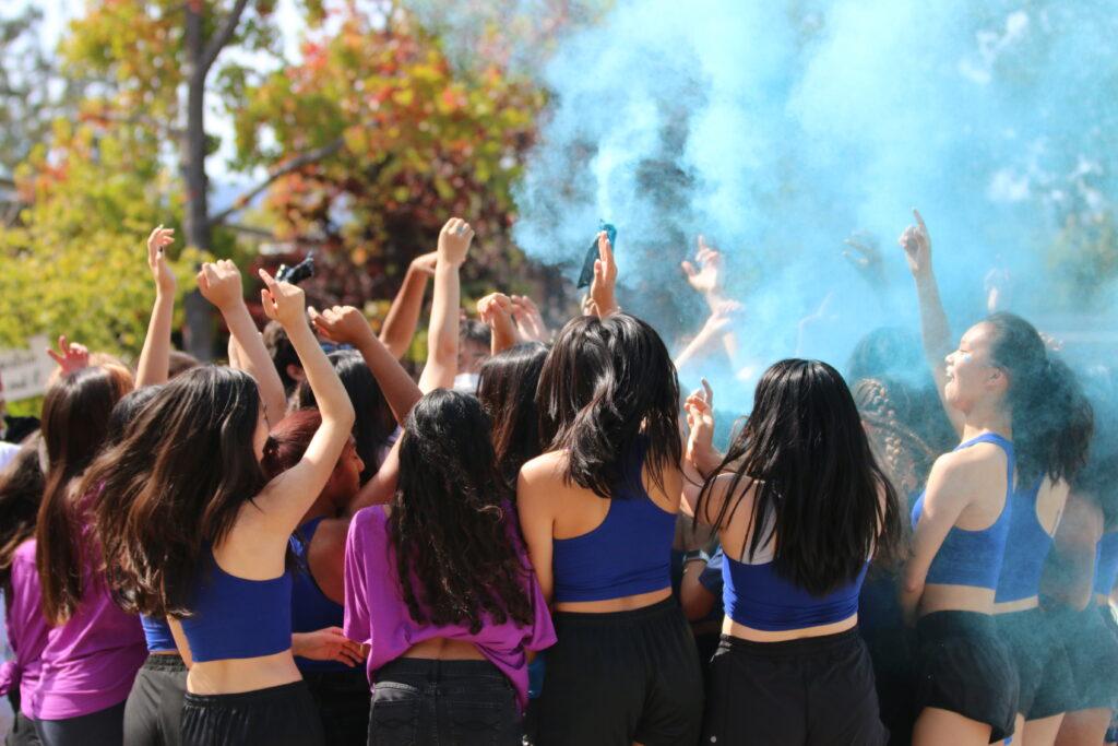 All Junior Quad Day participants mosh together in the haze of blue powder to cap off their performance