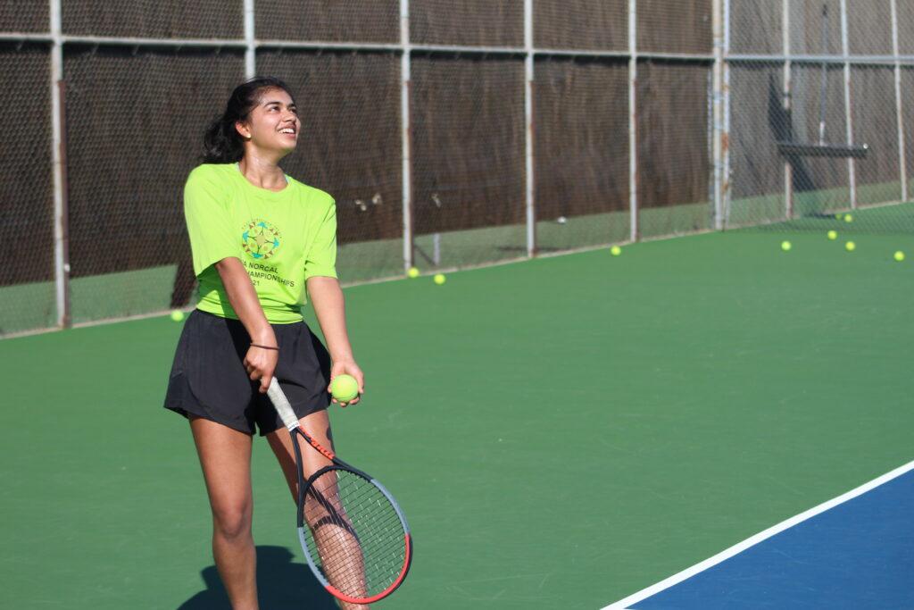 Horantur getting ready to serve during a practice match.