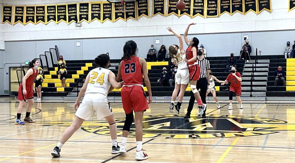Senior+Amarangana+Tyagi+reaches+for+the+ball%2C+pressing+with+the+player+from+Wilcox+next+to+her+in+the+Jan.+19+game+against+Lynbrook.
