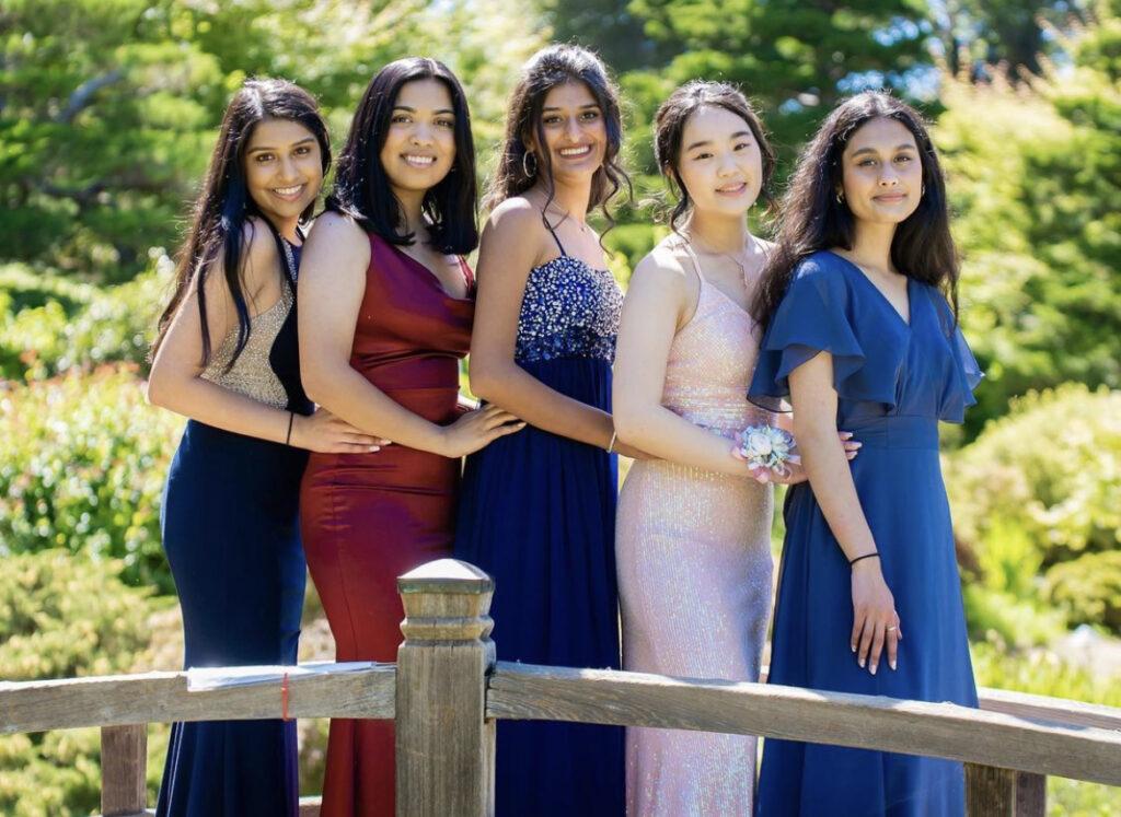 Class of 2021 alumna Irika Katiyar (middle) poses with her friends at prom in June.