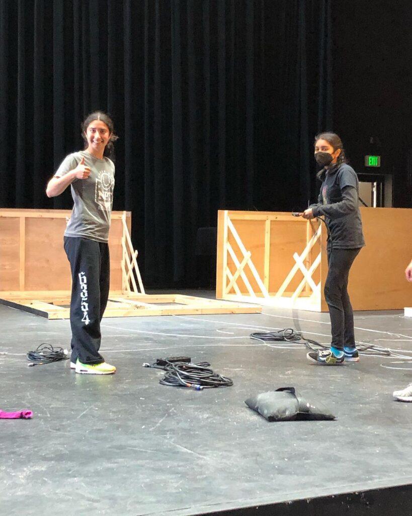 Sophomore Arushi Maheshwar (right) at the load-in on Sunday, March 27.