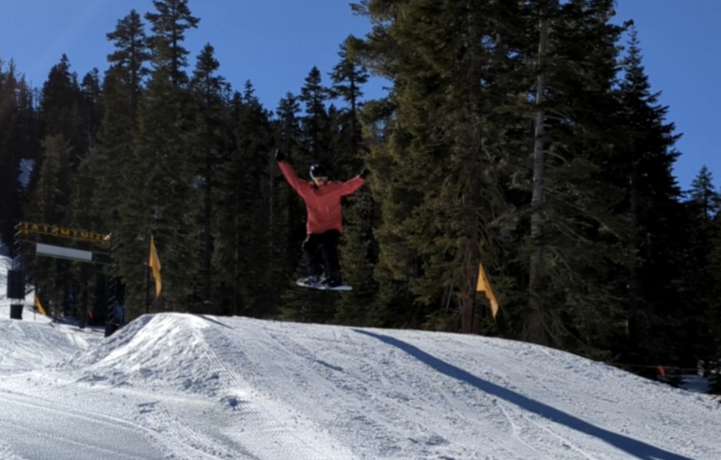 Kyle+Scola+hits+a+jump+off+a+ramp+at+the+Northstar+slopes+while+snowboarding.