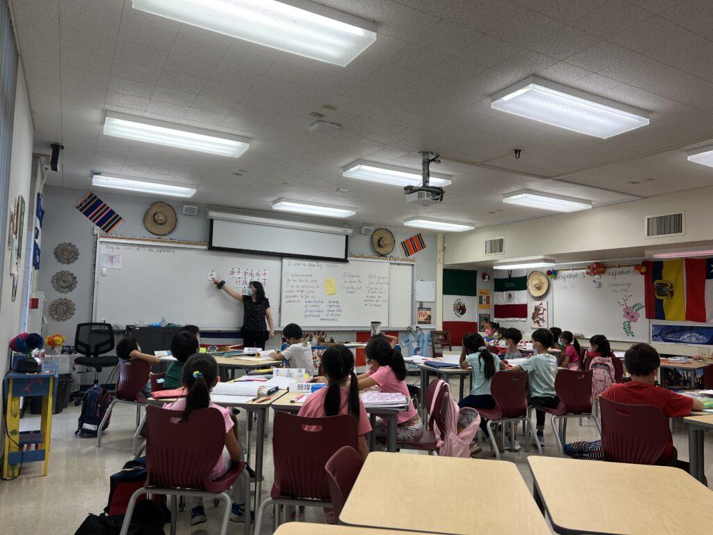 The students sit in one of the many classrooms rented by MLCC and listen carefully to their teacher as she teaches on a Saturday morning.