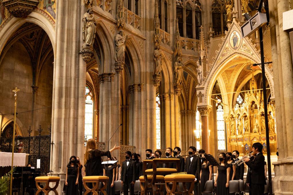 Choir students perform for church service in the Votivkirche church, Vienna.