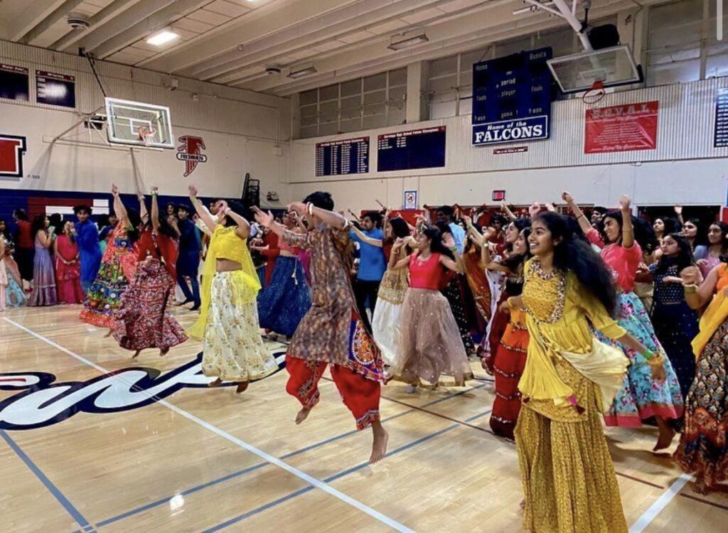 Students and parents learn Flash Mob dances at Garba.