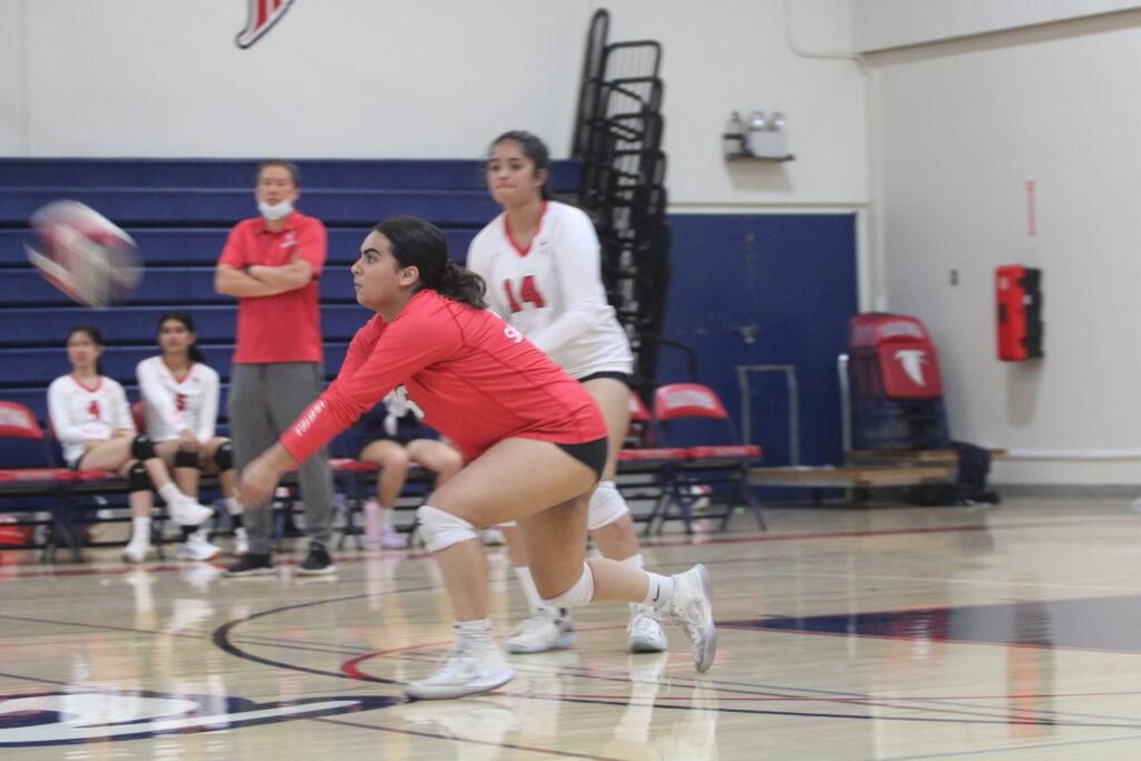 Senior libero Noor Khan hits the ball in their game against Lynbrook. The Falcons ultimately lost 3-0.