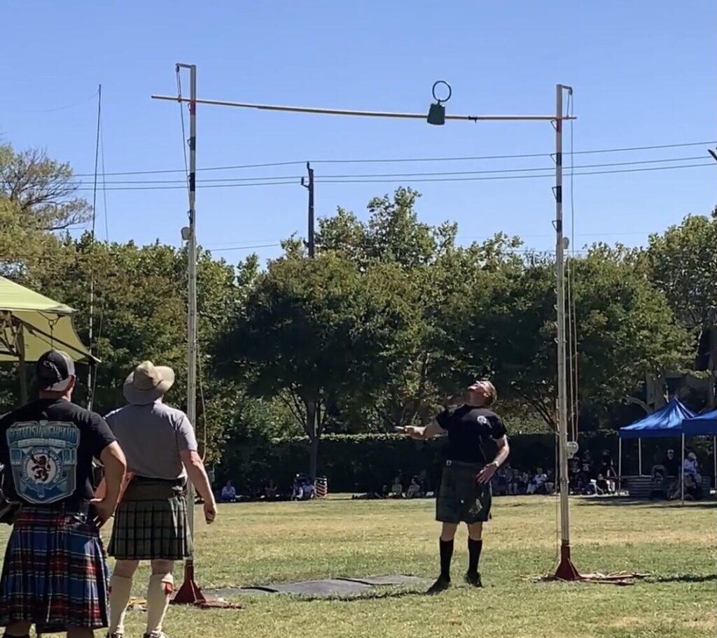 Orre watches the kettlebell he threw as it clears the bar in the Woodland Games 2019.