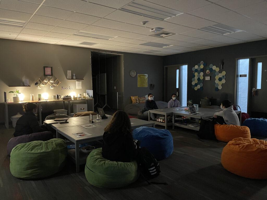 Students meditate on bean bags during a weekly class on Dec. 2.