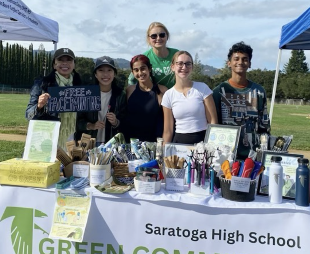 Green committee members run a booth at the Saratoga Education Foundation run, selling eco-friendly products like reusable utensils, straws, tote bags and water bottles.