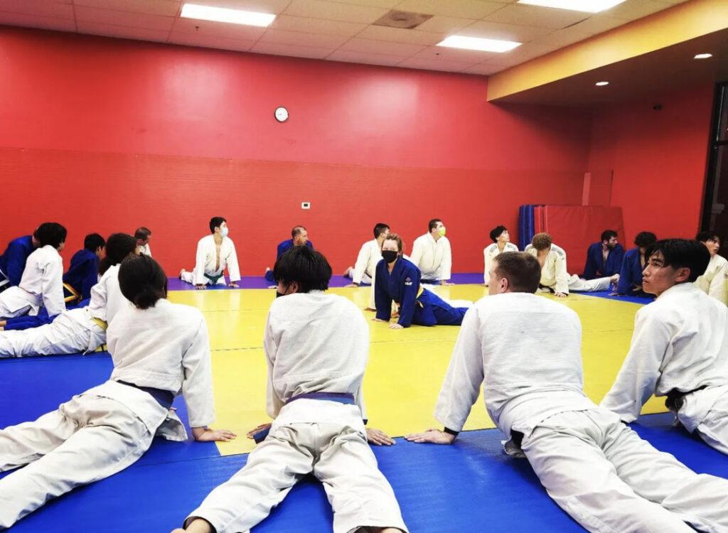 Ogata and her judo team warm up before their practice.