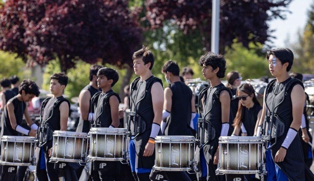Members of winter percussion warm up and get ready in the “lot” — the location outside the performance venue — during the Northern California Percussion Alliance (NCPA) Championships at American Canyon High.