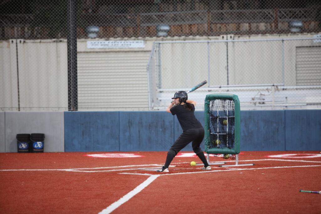 Junior Caitlin Weber prepares to bat in a scrimmage during practices on Feb. 9.