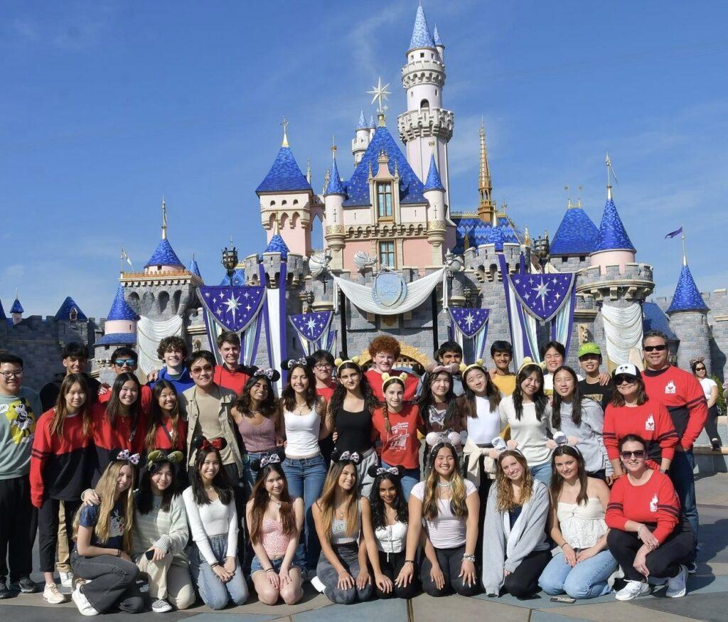 The leadership conference attendees pose in front of Aurora’s castle on the last day of the trip.