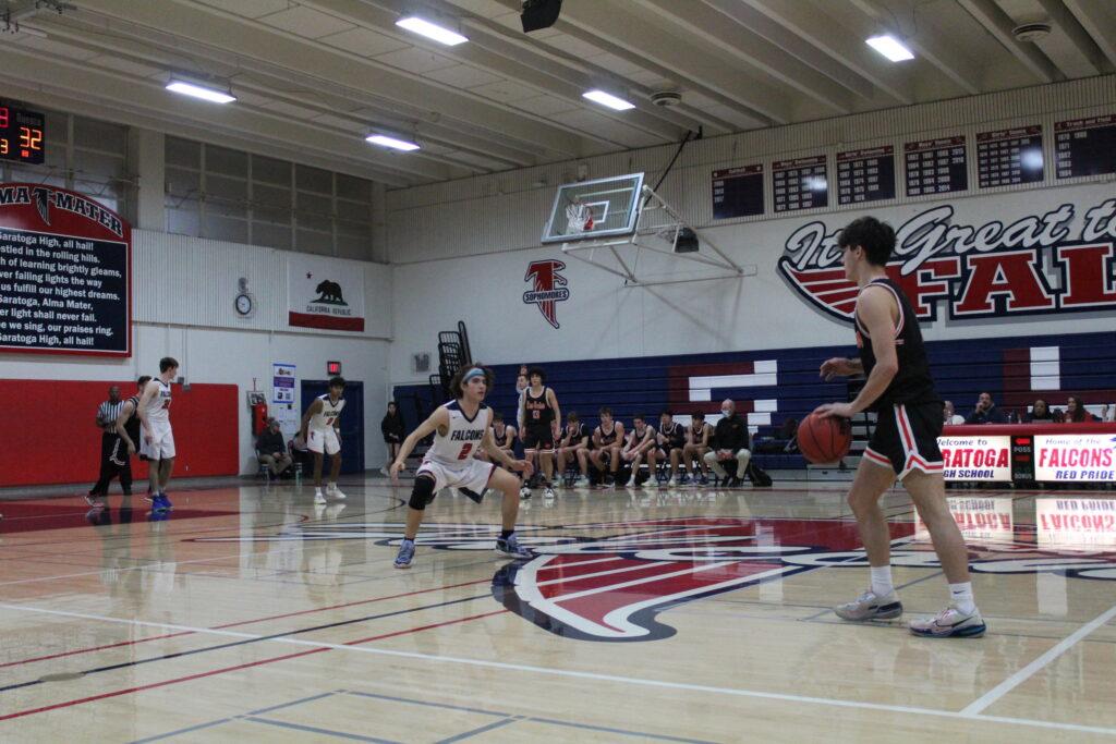 Senior guard Julian Berklowitz-Sklar gets ready for a defensive possession late in the team’s game against Los Gatos on Feb. 8.