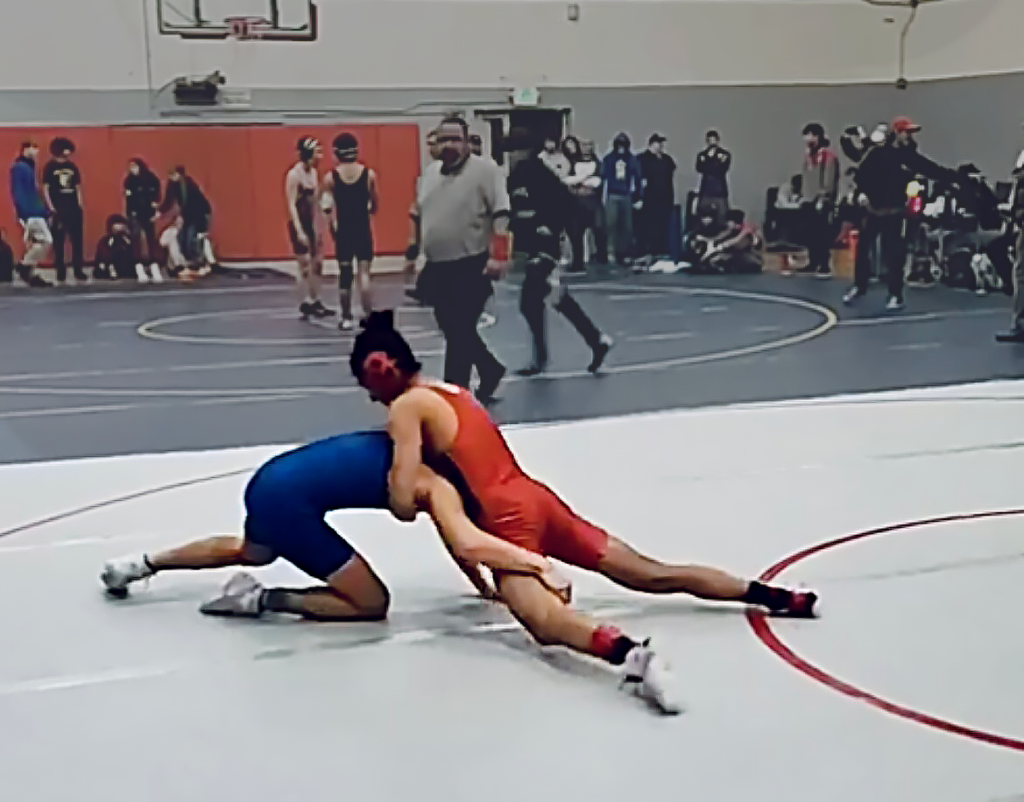 In a match at San Francisco on Jan. 28, Fernandes (in red) tries to subdue an opponent.