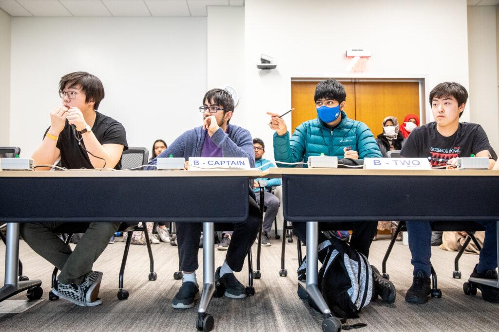 A-team members senior Adam Xu, senior Nilay Mishra, junior Advaith Avadhanam and senior Anthony Wang listen attentively as the round’s questions are being read.