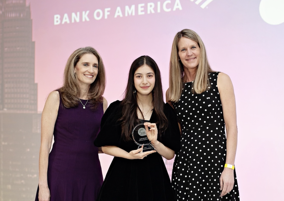 Junior Zeyneb Kaya poses with her award along with representatives of the Bank of America. 