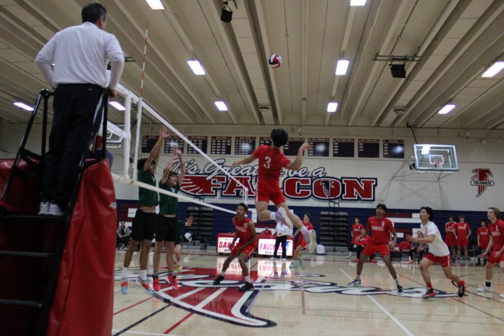 Freshman outside hitter Brennan Pak jumps up to spike the ball against Palo Alto on March 24.