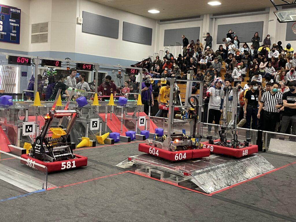 At the end of a qualification match, the team’s robot balances on the charge station.