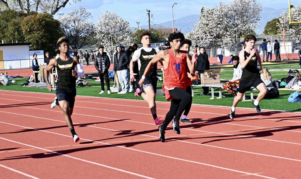 In a sprint event against Wilcox High on March 24, senior sprinter Yuvraj Singh speeds ahead of his competitors.