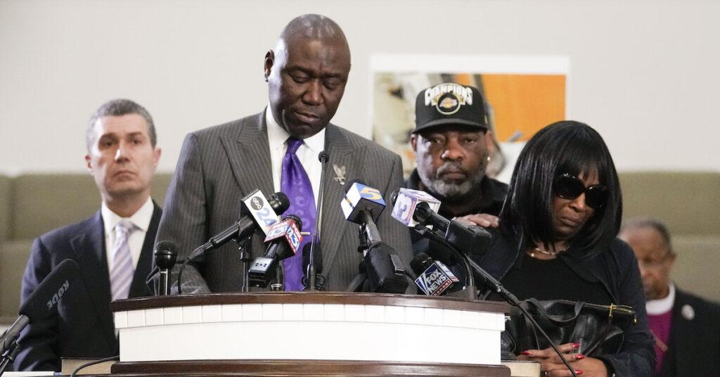 Nichols’s family attorney Ben Crump (center) speaks during a news conference with Nichols’s father (second from the right) and mother (right) on Jan. 23. 