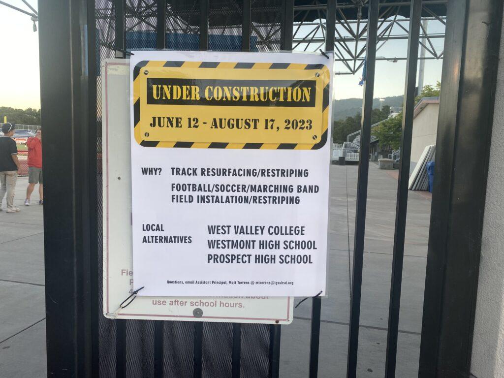 An “Under Construction” sign replaces the old sign — that showed the opening hours of the track and field.