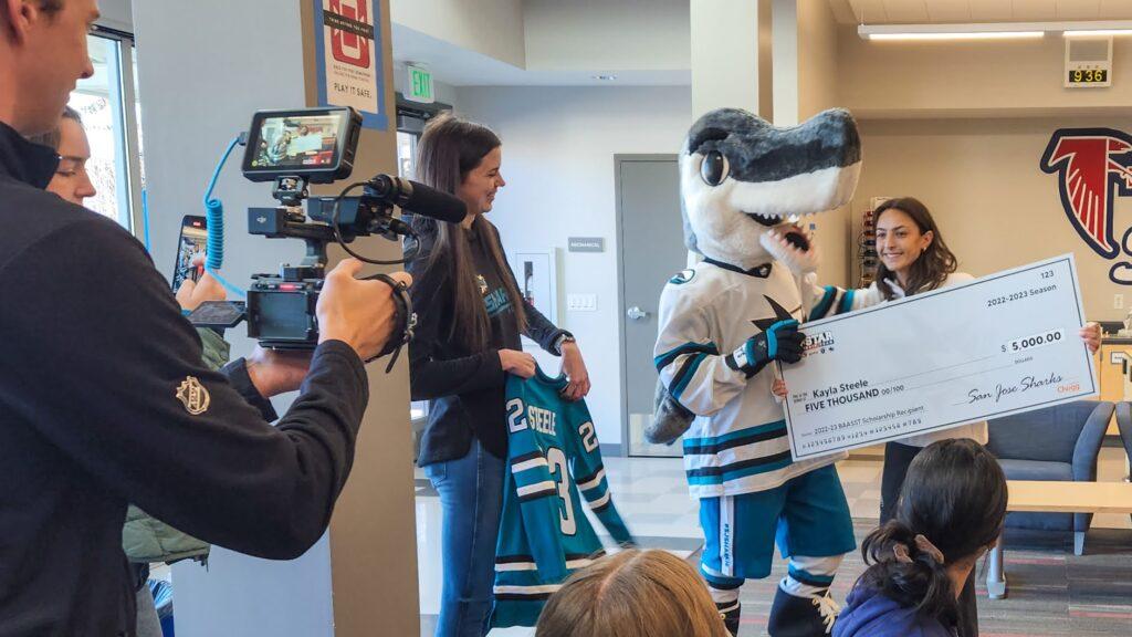 Sharkie, the mascot of the San Jose Sharks, came to give senior Kayla Steele her scholarship on March 1.