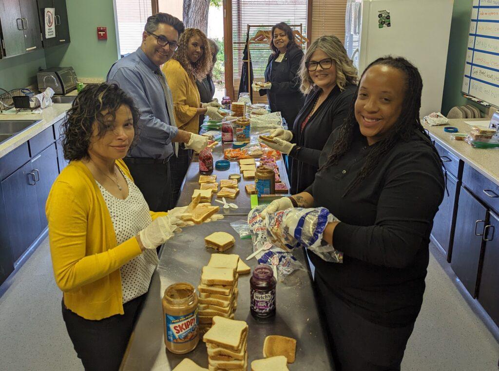 Employees at the District Office pack sandwiches for Martha’s Kitchen on April 25. 