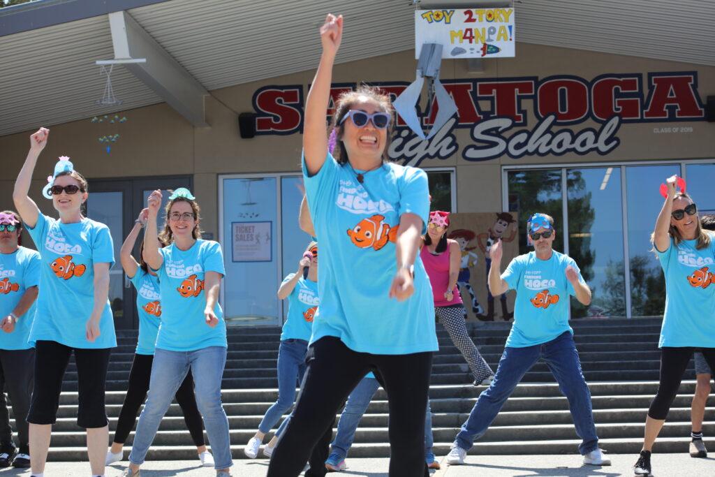 Biology teacher Kristen Thomson dances to “Baby Shark” during the faculty quad day.