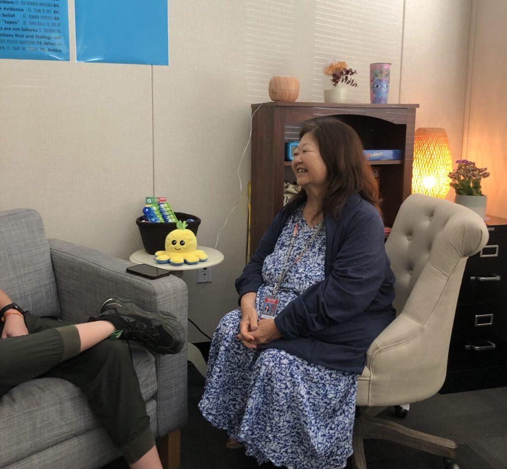 Tamashiro provides a therapy session to a student in the ASSIST program.