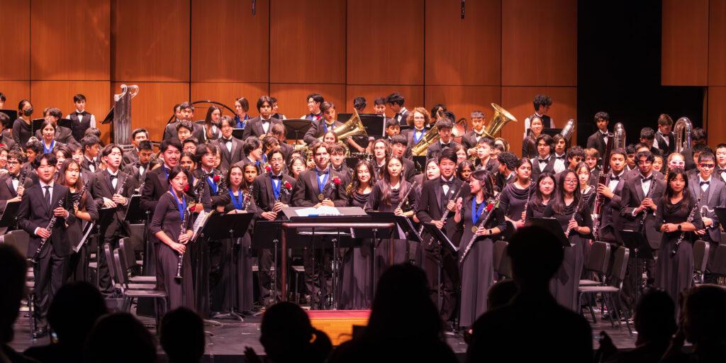 The Saratoga Wind Ensemble stands to take a bow during the 2023 Year-End Concert on May 25. 
