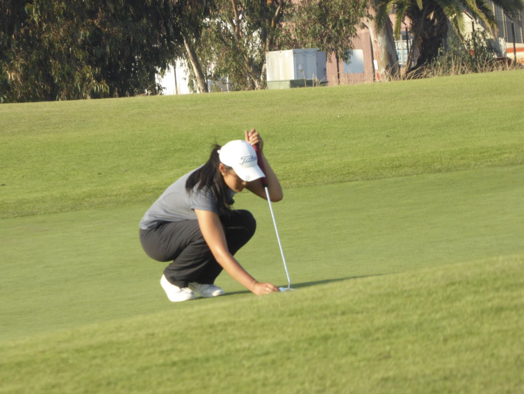Junior Sarah Lim marks her last putt at Baylands during the teams second match of the season on Aug. 30.