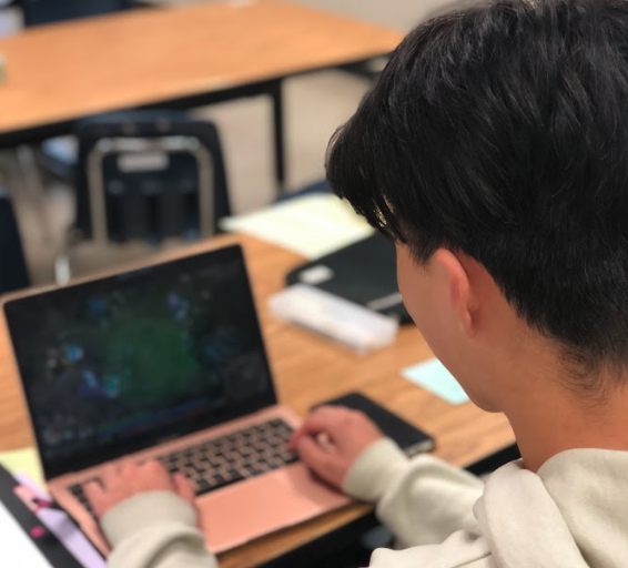 Sophomore William Huang vigorously plays the game League of Legends during an important class.