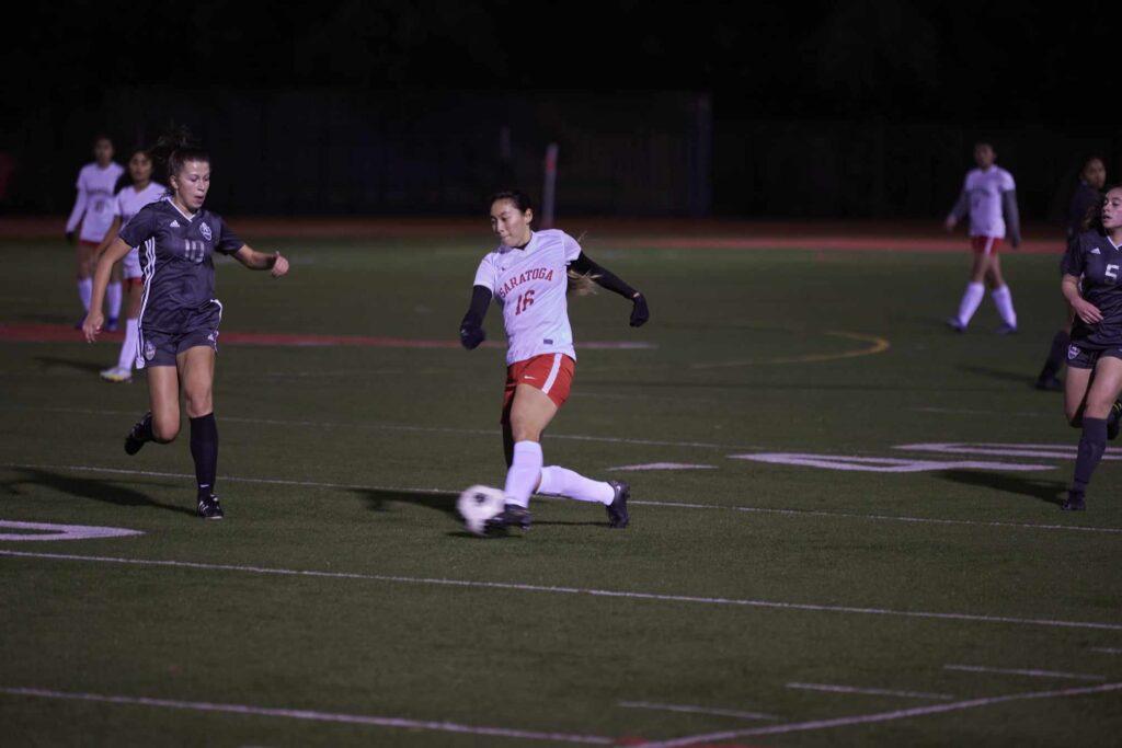 Senior center back Jiah Jung dribbles the ball during a game against Wilcox High on Dec. 7, 2022, seven weeks before her season-ending injury.