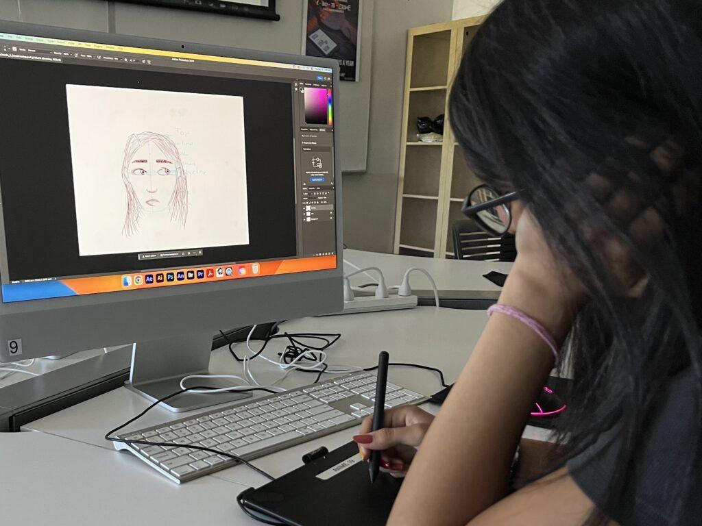 Sophomore Navya Chawla practices using Adobe Photoshop with the new iMacs.   