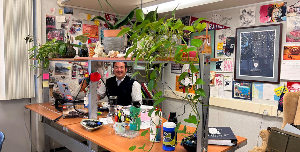 Rector+sits+inside+of+his+homemade+jungle.
