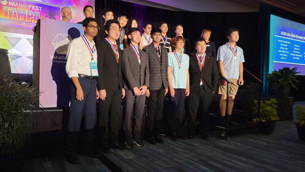 Senior Advaith Avadhanam and Class of 2023 alumni Anthony Wang, alongside other gold medalists, pose for a picture at the Math Olympiad Award Ceremony held in Tampa, Florida on Aug. 5.