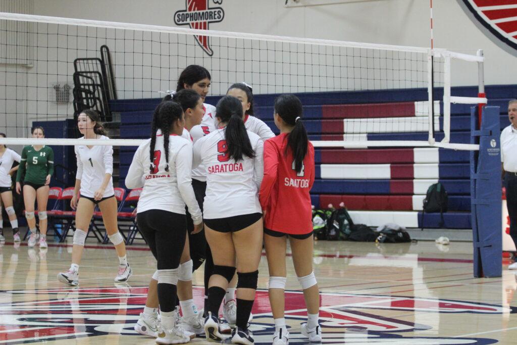 The team huddles and encourages each other during their senior night against Homestead on Oct. 18.