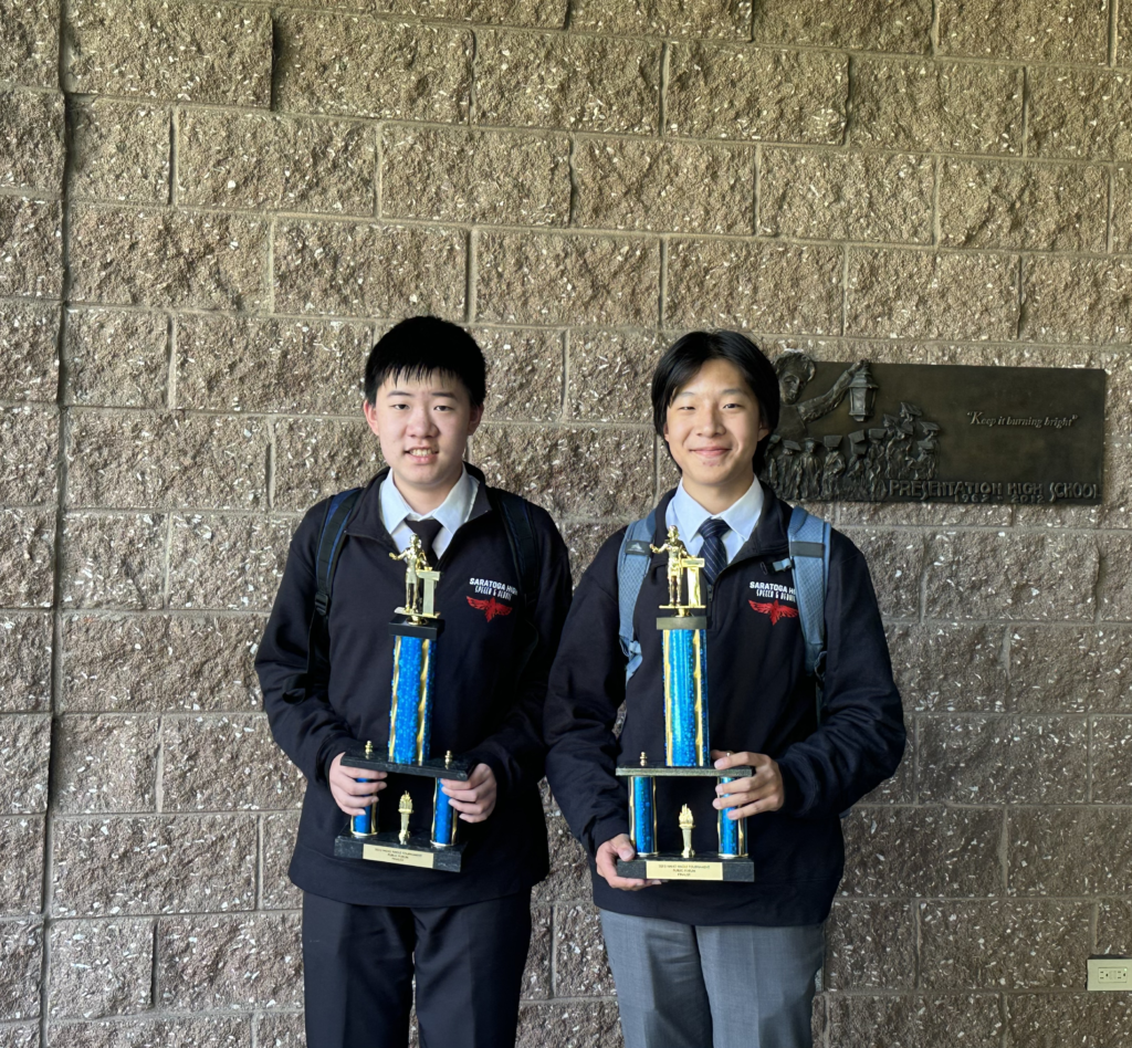 Sophomore Anthony Luo and junior Skyler Mao pose with their second-place trophies outside Presentation High School after the Nano Nagle Invitational on Oct. 8.
