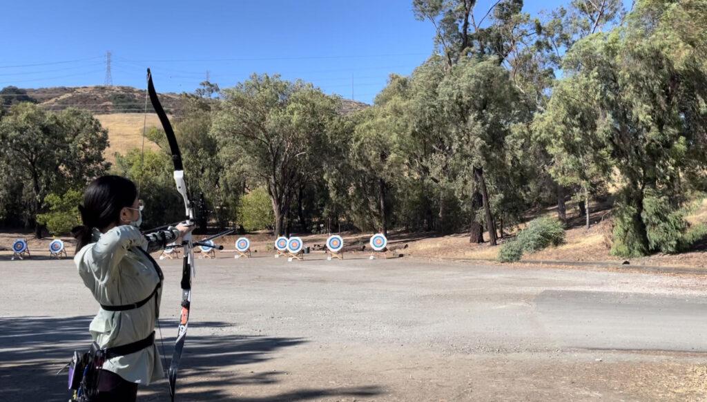 Li prepares to shoot at the Outdoor California Regionals Competition at the Black Mountain Bowmen Archery Range on Aug. 21, 2022. 