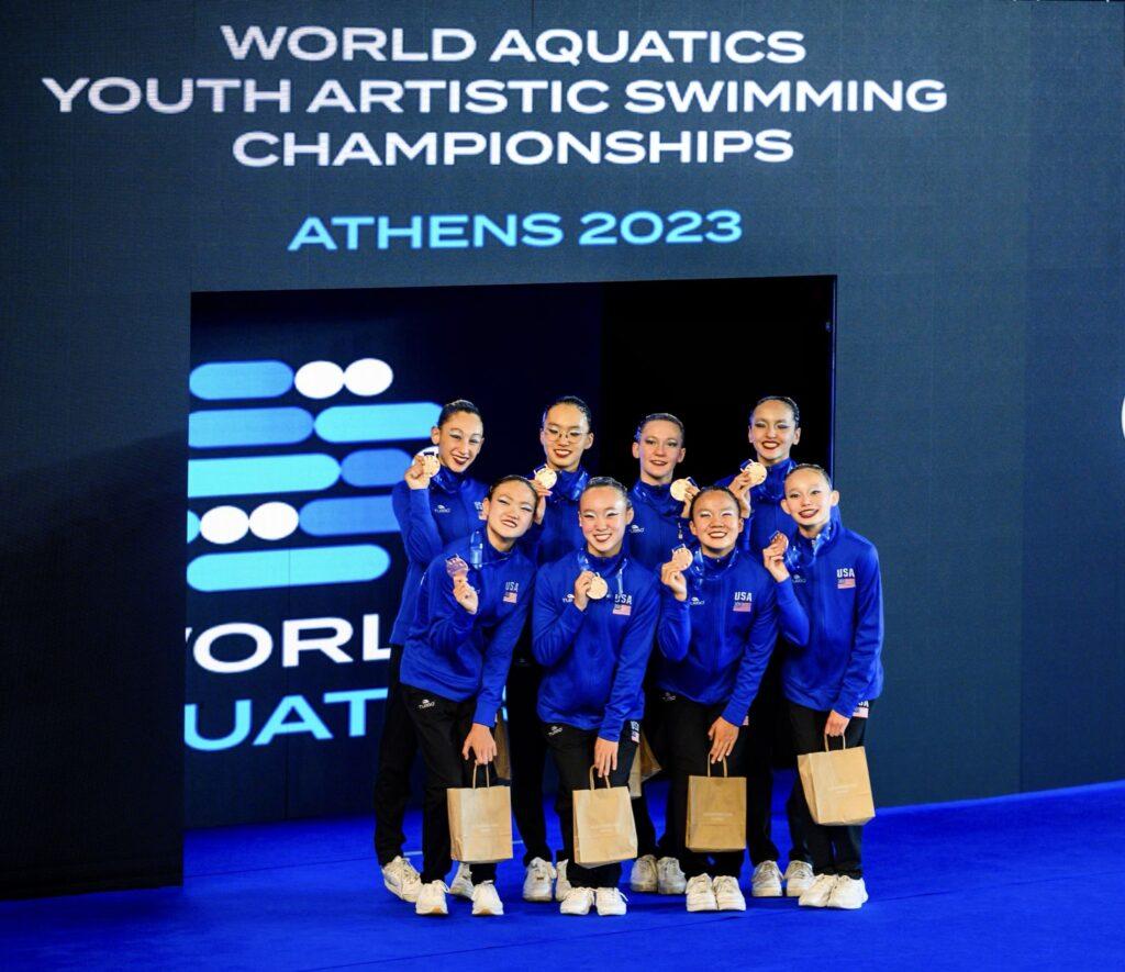Sophia Tsives (back row, left) poses with her team after winning bronze at the World Championships.