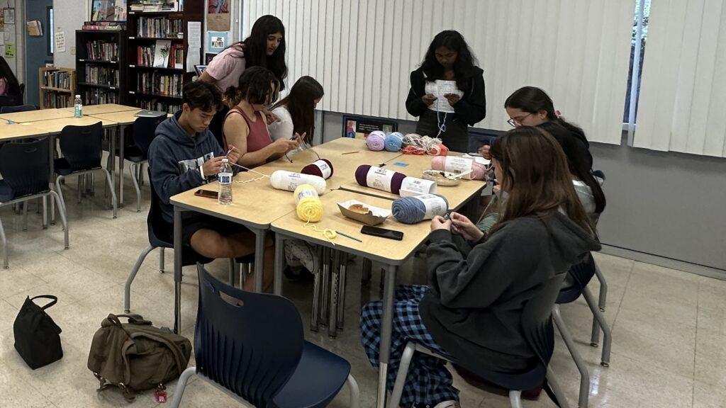 Students practice crocheting and knitting during Knit for Need Club’s second meeting on Oct. 25.
