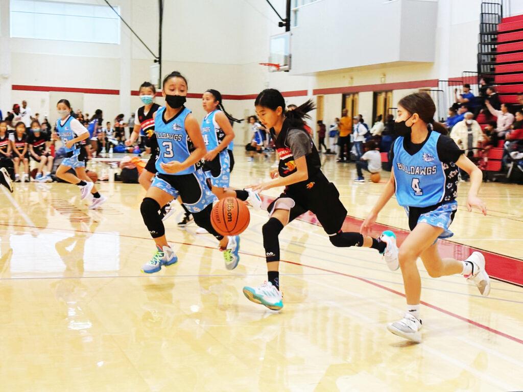 My sixth grade sister dribbling through defenders at a basketball tournament in San Francisco.